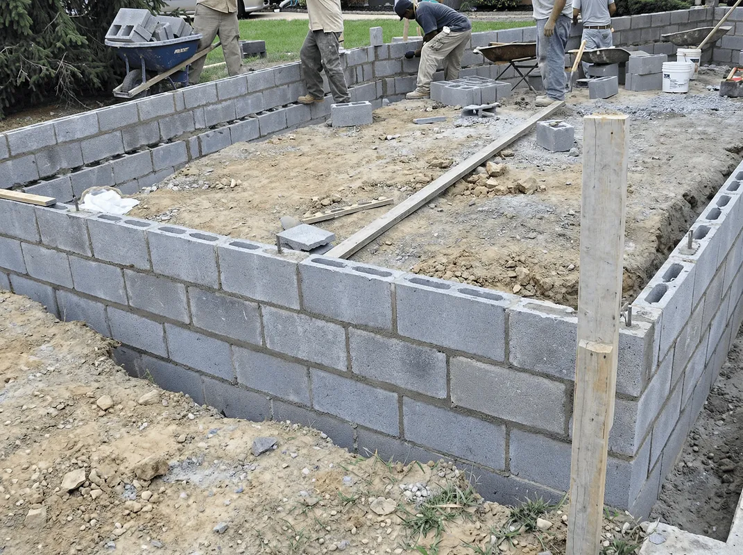 Professionals building a foundation with blocks in Aurora, IL